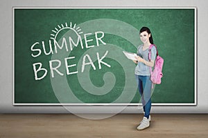 Happy student with tablet and summer break word