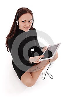 Happy student teenage girl sitting on the floor with tablet pc