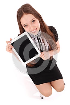 Happy student teenage girl sitting on the ladder with tablet pc