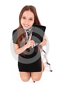 Happy student teenage girl sitting on the ladder with tablet pc