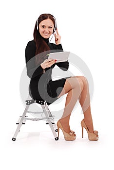 Happy student teenage girl sitting on the ladder with tablet pc