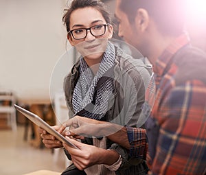 Happy students, discussion and browsing with tablet at cafe for project at indoor restaurant. Man, woman or friends on