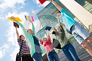 Happy students jumping for joy