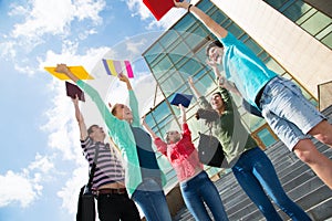 Happy students jumping for joy after the exam