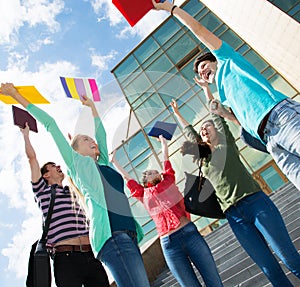 Happy students jumping for joy after the exam