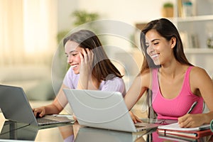 Happy students learning online at home