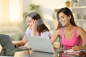 Happy students learning online at home photo