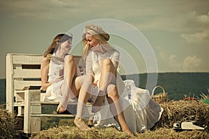 Happy students smiling with book and typewriter on blue sky