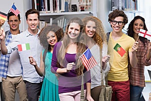 Happy students waving international flags