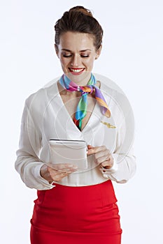 happy stylish air hostess woman on white