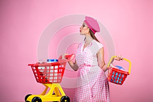 Happy stylish girl enjoying online shopping. savings on purchases. vintage housewife woman ready to pay in supermarket