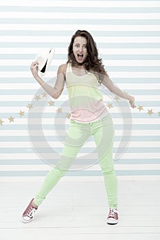Happy and stylish sexy woman. Crazy girl in colorful sporty clothes. Glamour fashion model. Hip hop woman dancer