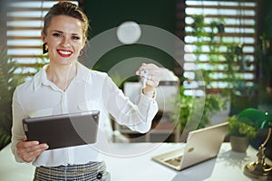 happy stylish woman realtor in modern green office