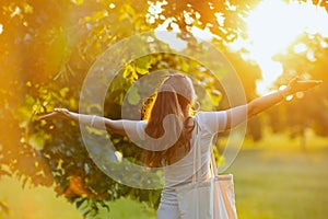 happy stylish woman in white shirt rejoicing