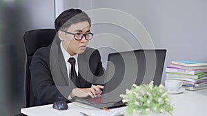 Happy successful business man using laptop computer