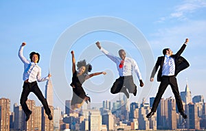 Happy Successful Business People Celebrating by Jumping in New Y photo
