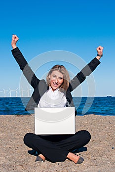 Happy successful business woman on the beach, vert