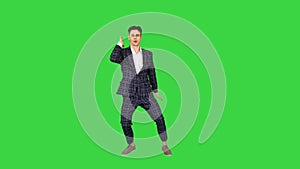 Happy Successful Businessman Dancing In a Crazy Way on a Green Screen, Chroma Key.