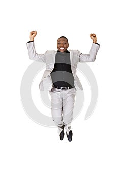 Happy successful businessman jumping
