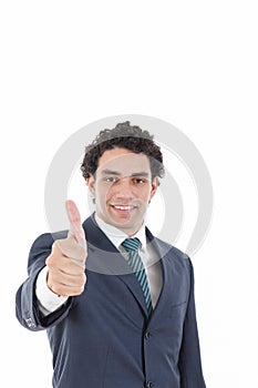 Happy successful businessman showing thumbs up gesture
