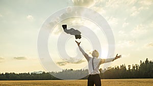 Happy Successful Businessman Throwing His Coat in the Air