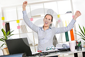 Happy successful Businesswoman in the office