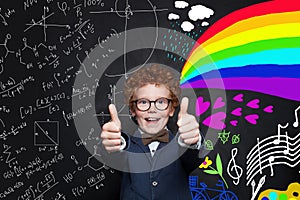 Happy successful child having fun against science formulas and art pattern background