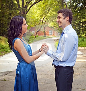 Happy successful couple near vacation home