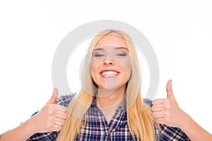 Happy successful girl with beaming smile showing thumbs up