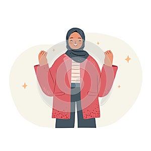 Happy successful girl in hijab showing yeah positive gestures with hands