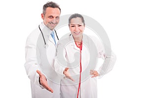 Happy and successful medical team doing handshake gesture