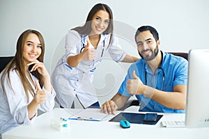 Happy Successful Medical Team work together in hospital