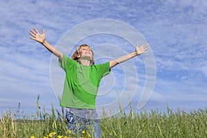 Happy summer child arms outstretched photo