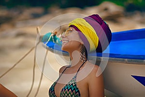 Happy summer girl in turban on the beach