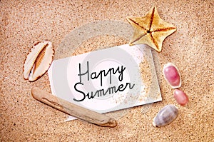 Happy summer written on a note on white beach sand