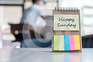 Happy Sunday text on note paper or empty reminder template on wooden table. New Goal New Start concept