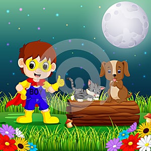 Happy super hero boy at night in the park with pets animal