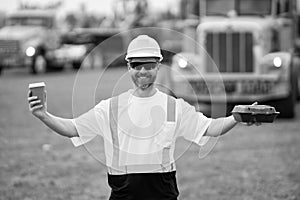 happy supervisor at the construction. supervisor man at construction site. worker at lunch break. male supervisor at