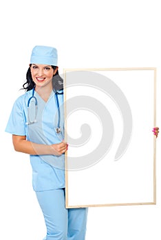 Happy surgeon female with blank placard