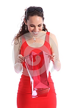 Happy surprise present in red bag for young woman