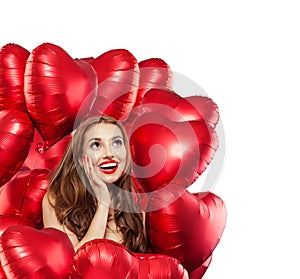 Happy surprised woman with red balloons isolated