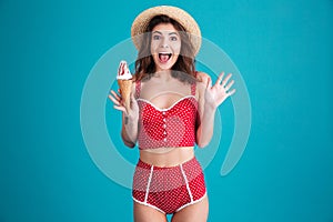 Happy surprised young woman with ice-cream