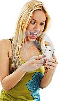 Happy and surprised young woman looking on mobile phone