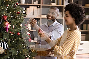 Happy sweet African American couple enjoying winter holiday time