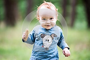 Happy sweet toddler in forest