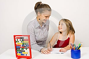 Happy teacher and little girl