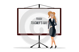 Happy Teacher`s Day. A kind teacher stands at the chalkboard