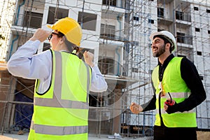 Happy team of architect or engineer with success and glad at construction site, team contractor or worker or partner glad.