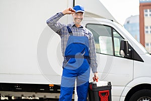 Happy Technician Service In Overall Near Van photo