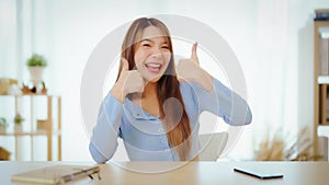 Happy teen asian girl blogger smiling face waving hand talking to webcam recording vlog, social media influencer streaming